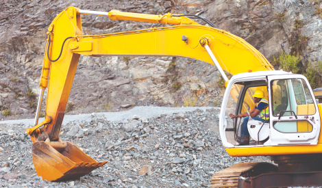 worker operating an excavator